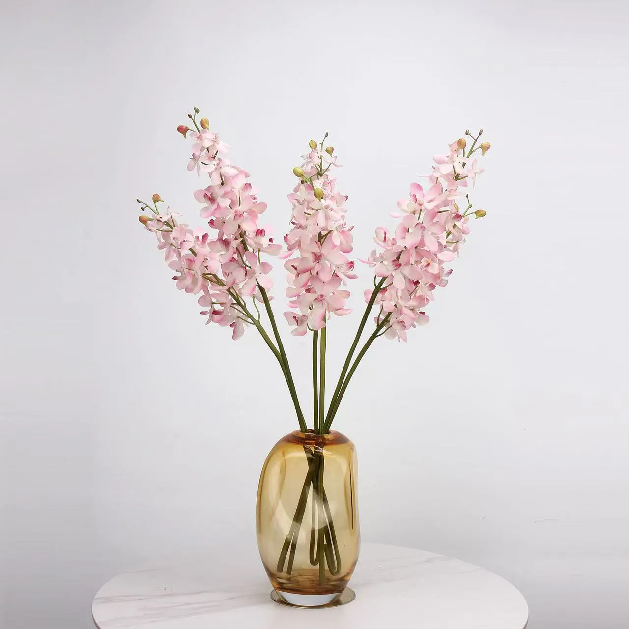 The application of tall vase artificial flower arrangements